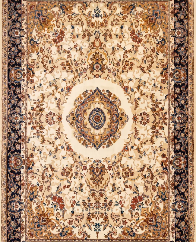 A detailed traditional rug with a geometric central medallion, dense floral motifs and a bold patterned border.
