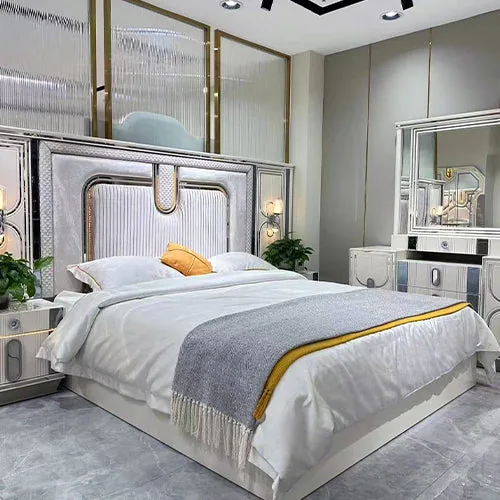 Contemporary upholstered bed with a textured, panelled headboard and metallic trim.