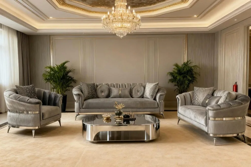 A tufted fabric lounge suite with plush cushions and metallic-toned legs, shown in a light living room.