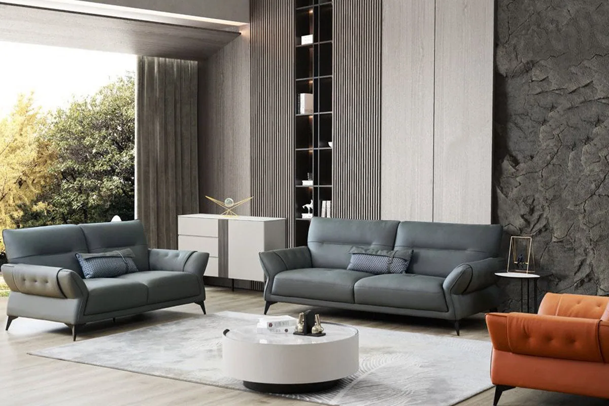 A six-seater fabric sofa set in a single uniform tone, including a matching single chair.