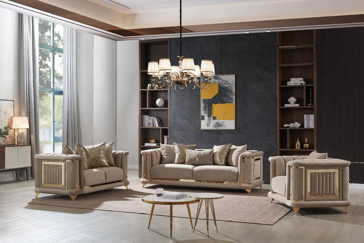 A large eight-seater sofa set in warm neutral fabric with quilted side panels and gold accents.